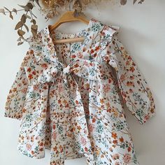 This charming baby girl dress is the perfect choice for any special occasion. Handmade with care, this boho-style dress features a delicate wildflower pattern, adding a touch of nature-inspired elegance. The large bow and ruffled details make it perfect for ceremonies, weddings, or even as a unique party outfit for your little one. This garment is made with 100% high quality fabric (cotton). Each garment is designed, printed, cut, sewn, photographed and packaged in our own studio. Order today an Wildflower Pattern, Boho Style Dresses, Large Bow, Boho Baby, Dress Boho, Girl Dress, Style Dress, Boho Dress