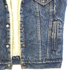 Vintage Levi’s Denim Vest 1970s made in USA size: 36R, small measurements: armpit to armpit: 21” top of neck to bottom: 26” Vintage Denim Jeans For Winter, Fitted Denim Top For Winter, Fitted Medium Wash Denim Vest For Winter, Fitted Dark Wash Denim Vest For Winter, Fitted Denim Vest In Medium Wash For Winter, Fitted Denim Vest In Dark Wash For Winter, Vintage Fitted Denim Top With Pockets, Fitted Vintage Denim Top With Pockets, Retro Fitted Denim Vest