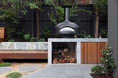 an outdoor fire pit with logs in it