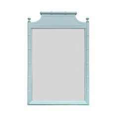 a blue bamboo framed mirror on a white wall with the reflection of it's frame