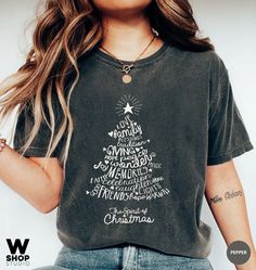 Rockin Around The Christmas Tree Shirt, Christmas Graphic Tee With Letter Print, Christmas Gift Tops With Text Print, Christmas Text Print Tops As Gifts, Christmas Graphic Tee With Text Print, Christmas Short Sleeve T-shirt With Text Print, Christmas Cotton T-shirt With Text Print, Relaxed Fit Christmas T-shirt For Holiday, Christmas Text Print Short Sleeve T-shirt