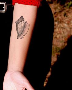 a woman with a deer tattoo on her arm