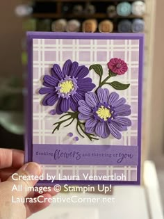 a hand holding up a card with purple flowers on it and the words, created by lauren ververlohh all images @ stampin up