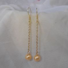 Welcome back to my shop: https://www.etsy.com/shop/pearlandjewelry Description of the product in the picture: I make them with 6mm golden Shell pearl pearls and sterling silver and golden sterling silver post,It is nice for your wedding. The earring is the total length of 5.5 cm The picture pearl color is golden. Can choose other colors are: golden, champagne, pearl white, bright red. Gold Delicate Pearl Earrings For Bridesmaid, Gold Pearl Earrings For Bridesmaids, Hypoallergenic Gold Pearl Earrings For Party, Classic Gold Earrings For Bridesmaids, Gold Dangle Earrings For Bridesmaid Gift, Classic Gold Earrings For Bridesmaid Gift, Gold Dainty Pearl Earrings For Party, Dainty Gold Pearl Earrings For Party, Hypoallergenic Gold Earrings For Bridesmaids