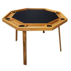 an octagonal wooden table with black top