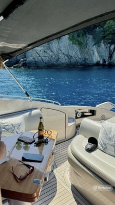 a woman sitting at a table on top of a boat