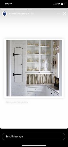 an image of a kitchen with white cabinets and cupboards on the left side of the screen