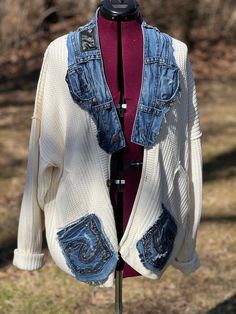 Very cozy up cycled cardigan sweater. This is a nice heavy knit sweater with denim Jean embellishments on collar and pockets. All four pockets on the front work as do the buttons. If you like, cozy unique style this is for you! Heavy Knit Sweater, Sweater Oversized, Sweater Oversize, Heavy Knit, Salisbury, White Cardigan, Oversized Sweater, Denim Jean, Cardigan Sweater