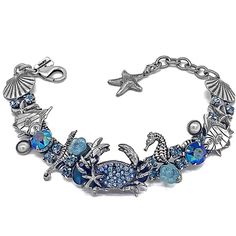 "Under the Sea blue crab bracelet....I had to create a blue crab since I am from Baltimore, Maryland! This is one of everyone 's favorite sea themed bracelet along with the sea turtle but then again the mermaids are amazingly popular Decisions decisions The bracelet is antique silver and set with mabe pearls and blue Abalone cabashons and accented in Capri blue aurora borealis and aqua Swarovski! Approximately measuring 7\" plus a 1&1/2\" extender with a starfish charm." Blue Bracelets With Lobster Clasp For Beach, Blue Metal Charm Bracelet With Lobster Clasp, Blue Metal Bracelets For Beach, Turquoise Ocean-inspired Bracelet With Lobster Clasp, Adjustable Blue Oyster Bracelet Jewelry, Blue Metal Jewelry For Beach, Blue Adjustable Charm Bracelet With Lobster Clasp, Adjustable Ocean-inspired Charm Bracelet With Lobster Clasp, Ocean-inspired Blue Charm Bracelet For Gifts