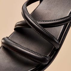 Discover premium comfort with the Tiare Strappy, the most formal style in our Tiare line. This sandal pairs luxurious comfort with a beautifully crafted leather ankle strap, making it the ideal companion for your favorite dress. Whether it's a night out or a stylish day around town, the Tiare Strappy offers versatility and comfort. Inspired by the elegant Tiare flower of Polynesia, it's perfect for all-day wear, blending the best of luxury and comfort. It's the top choice for those seeking styli Luxury Black Slingback Sandals With Single Toe Strap, Leather Strappy Slingback Sandals For Evening, Luxury Leather Strappy Slingback Sandals, Luxury Black Strappy Sandals, Chic Double Strap Evening Sandals, Chic Double Strap Sandals For Evening, Chic Black Calf Leather Slingback Sandals, Sleek Black Strap Sandals, Sleek Black Strapped Sandals