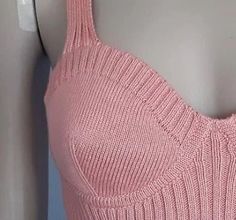 a woman's pink tank top on a mannequin