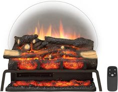 an electric fireplace with logs and fire in the center, next to a remote control