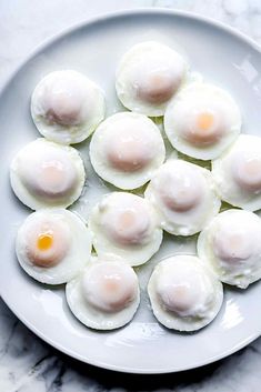 eggs are arranged on a white plate