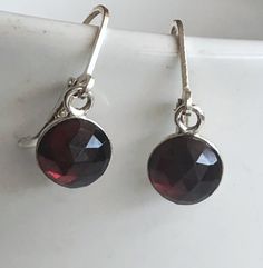 "Genuine Garnet Earrings Sterling Silver, Red Garnet Earrings Drop, January birthstone These garnet earrings will make a great gift! They made from: - Genuine faceted Mozambique red garnet 8mm cabochons set in sterling silver - Sterling silver lever back ear wires The earrings are about 1 \" long. Your order will be mailed within 2 business days nicely packaged and ready to be given. All US orders and most international orders will have tracking#. To see more of my jewelry: https://www.etsy.com/ Garnet Round Earrings For Anniversary, Garnet Earrings For Anniversary, Round Garnet Earrings For Anniversary, Anniversary Garnet Round Earrings, Red Faceted Garnet Earrings, Elegant Faceted Garnet Earrings, Garnet Jewelry With Matching Round Earrings, Garnet Drop Earrings As Gift, Garnet Faceted Drop Earrings