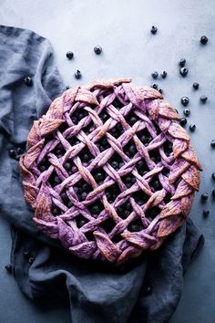 a blueberry pie sitting on top of a table