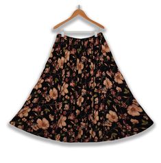 "Long Skirt- Floral Skirt- Maxi Skirt- Boho Skirt- Ankle Length Skirt- Peasant Skirt- Festival Skirt- Renaissance Folk Skirt- Vintage Hippie Skirt  Neo Nostalgia | Made in India   Women's long floral skirt- multicolored black/apricot/purple/beige/green/blue  Ankle-length depending on height | tapered hem       Stretchy elastic waist/hip band       Excellent vintage condition   Material - 100% Rayon | stretchy with give       Size - L - please check measurements>  Waist/hips (lax) - 26\"   Waist/ Flowy Long Floral Print Pleated Skirt, Traditional Wrap Skirt For Spring, Traditional Pleated Skirt For Spring, Traditional Full Skirt For Spring, Ankle-length Relaxed Lined Skirt, Bohemian Ankle-length Flowy Skirt, Festive Bohemian Flared Skirt, Floral Print Stretch Maxi Skirt, Ankle-length Relaxed Maxi Skirt With Lining