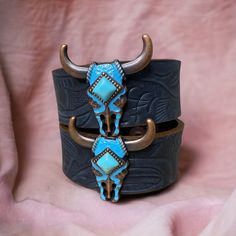 "These are one of our most popular bracelets we currently sell. Turquoise bull concho on a black embossed leather bracelet. It has 2 adjustable snap closures. The overall length of the bracelet is about 8.75\" long and it is 1\" wide. The adjustable snap closures are at about 7\" and 7.75\". To make sure this bracelet will fit you, measure the distance around your wrist. If you have any questions or need assistance don't hesitate to send us a message." Adjustable Western Leather Bracelet For Festivals, Western Concho Bracelets For Festival, Western Style Concho Bracelets For Festivals, Adjustable Western Cuff Bracelet For Festivals, Adjustable Hand Tooled Western Leather Bracelet, Adjustable Western Style Cuff Bracelet For Festivals, Adjustable Western Style Festival Cuff Bracelet, Western Style Adjustable Cuff Bracelet For Festivals, Western Style Turquoise Leather Bracelets