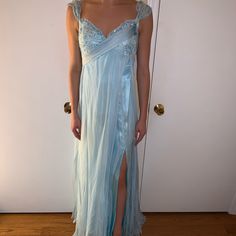 Light Blue Jovani Gown, Size 2-4. Never Worn, In Decent Condition. Stain On The Front Of The Gown. Never Altered Light Blue Chiffon Formal Dress, Blue Chiffon Gown For Prom Season, Blue Chiffon Gown For Prom, Blue Chiffon Prom Gown, Blue Chiffon Evening Dress With Fitted Bodice, Blue Fitted Chiffon Gown, Blue Chiffon Evening Dress For Prom, Fitted Blue Chiffon Gown, Light Blue Floor-length Evening Dress For Homecoming