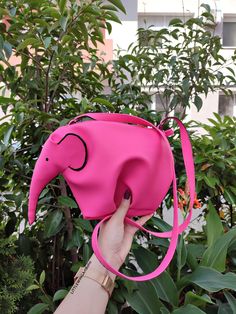 ♥Limited edition! This listing is for one PINK - ECO leather elephant bag! One of the best accessories bohemian cross-body bag is truly unique! Perfect for your personal objects, coins, decorative objects, jewelry, or other valuable items and accessories such as electronic devices (smartphones, chargers...) This clutch is very strong and durable, fashionable, classic but very stylish, perfect for your daily life, for a unique look, special occasions or events, etc. This is my favorite purse, perfect for summer days and summer nights. A zipper top. This zipper bag is highly versatile! Use it as a wallet, for makeup, or a small bag for an evening walk. 100% Handmade * Ready To Ship * This bag has been made with love and attention. Height: 21 cm ( 8 in ) Width: 30 cm ( 11 in ) Depth: 18 cm ( Pink Handheld Satchel, Pink Handheld Satchel For School, Pink Handheld Portable Satchel, Portable Pink Satchel For Daily Use, Pink Portable Satchel For Daily Use, Pink Mobile Phone Bag For Travel, Pink Satchel With Mobile Phone Bag For Travel, Pink Shoulder Bag For Mobile Phone, Pink Pouch Shoulder Bag For School