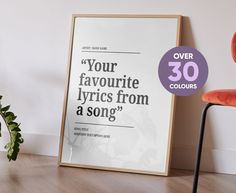 a poster with the words your favorite lyrics from a song on it next to a chair