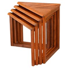 three wooden tables stacked on top of each other