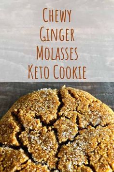 chewy ginger molasses keto cookie on a wooden table with text overlay