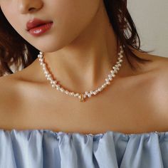 Enhance your elegance with our Simple Staggered Pearl Clavicle Necklace – a classic yet modern accessory that embodies sophistication. Crafted with precision and featuring an 18K gold-plated process, this necklace is a timeless addition to your collection. Materials: Copper Natural Pearl (4*7.5mm) The simple design, paired with staggered natural pearls, creates a chic and versatile necklace that effortlessly complements your style. Size: With a necklace circumference of 38-43cm, this piece is de Chic Pearl Necklace With Pearl Charm, Chic Pearl White Necklace With Pearl Charm, Elegant Pearl Charm Choker Necklace, Elegant Pearl Choker Necklace With Pearl Charm, Cream Pearl Necklace With Charm As A Gift, Cream Pearl Chain Jewelry, Feminine Pearl Necklace With Pearl Charm, Classic Pearl White Choker Necklace, Minimalist White Pearl Embellished Necklace