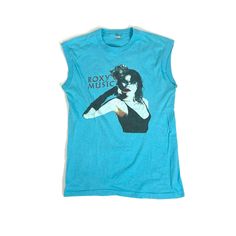 a blue shirt with a woman's face on it and the words roxy music