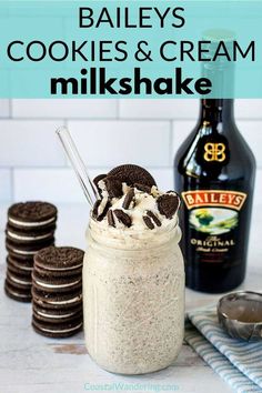 cookies and cream milkshake in a mason jar with oreos on the side