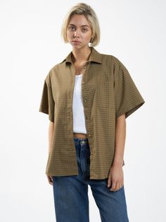 Combining Thrills' focus on style and comfort, the Dawson Plaid Shirt in Mustard Gold is thoughtfully crafted with a generously roomy fit for superior mobility and a plaid pattern to elevate any casual outfit. With a full button-up and a versatile length, this plaid shirt for women is easy to style. Leave it open and l Relaxed Fit Collared Flannel Shirt For Workwear, Brown Relaxed Fit Flannel Shirt For Workwear, Plaid Tops With Button Closure And Relaxed Fit, Plaid Top With Button Closure And Relaxed Fit, Relaxed Fit Plaid Shirt For Daywear, Classic Plaid Tops For Casual Gatherings, Oversized Plaid Tops For Work, Oversized Plaid Tops For Everyday, Relaxed Fit Gingham Button-up Shirt