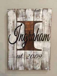 a wooden sign with the name and date on it