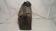 Vintage 1980's military green canvas bag - shoulder bag - NEW. Measurements: H - 10'' [ 25cm.] W - 10'' [ 25cm.] Side - 5'' [ 12.5cm.] One section and one pocket inside. Leather clasps.Adjustable canvas long handle - max.39 2/5'' [100cm.] UNUSED. NOTE: All vintage items in my shop that are used have been restored according to the possibilities All defects are removed,except the normal signs of use over the years. Thank you and successful shopping. Green Rectangular Canvas Bag For Outdoor, Green Canvas Crossbody Satchel, Green Canvas Satchel For School, Green Satchel Shoulder Bag With Canvas Lining, Military Style Outdoor Satchel Bag, Military Style Satchel Bag For Outdoor, Canvas Satchel In Khaki For School, Outdoor Military Satchel Bag, Military Style Satchel For Outdoor