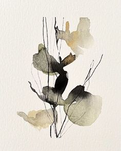 watercolor painting of leaves on white paper with black and yellow inks in the background