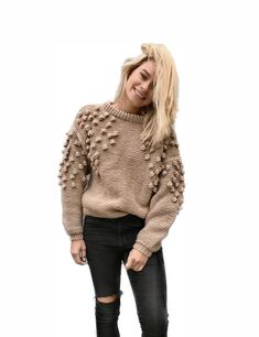 "A cozy hand knitted sweater for women. This sweater will be the most favorite in your wardrobe. Bulky popcorn design  will look perfect as part of your stylish look.  It can be worn as casual sweater or as bohemian part of party look. Beige  color would look perfect any time of the year, and specially on autumn or winter. Our cable knit pullover  would perfect addition to your look in Summer evening. This women beige jumper is long and has long sleeves.  Oversized chunky handmade sweater will b Bohemian Chunky Knit Brown Sweater, Bohemian Brown Chunky Knit Sweater, Beige Bohemian Chunky Knit Sweater, Bohemian Chunky Knit Sweater For Fall, Bohemian Long Sleeve Cable Knit Sweater, Trendy Hand Knitted Sweater For Fall, Trendy Hand Knitted Fall Sweater, Trendy Hand-knitted Fall Sweater, Beige Bohemian Sweater With Textured Knit