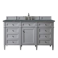 a bathroom vanity with two sinks and drawers on the top, in grey wood finish