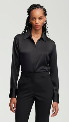 Made of a stretchy silk satin, this slim fit blouse is sure to become a daily favorite. The lightweight, airy silhouette allows for comfortable movement and natural stretch. Easy to tuck and style with your favorite pair of trousers or skirt. Sleek Solid Blouse For Night Out, Sleek Blouse For Night Out, Classic Black Satin Top, Elegant Viscose Blouse For Night Out, Classic Silk Top For Night Out, Classic Satin Blouse For Night Out, Fitted Satin Blouse For Work, Semi-formal Silk Tops In Solid Color, Elegant Satin Tops For Workwear