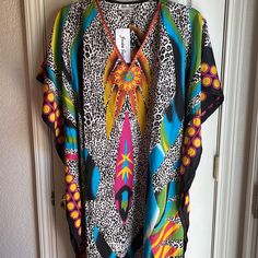 Nwt Jessica Taylor Embellished Bodice. Colorful Animal Print Caftan Includes Red, Orange, Yellow, Gold, Blue, Green, Aqua, Beige And Black Print Caftan. One Size. Caftans Are The New Work At Home Attire!! Fabric Is 100% Polyester. H Black Printed V-neck Kaftan, Black Printed Kaftan For Festival, Multicolor V-neck Kaftan For Beach, Multicolor V-neck Tunic For Beachwear, Black Beach Dress With Colorful Pattern, Multicolor Printed Tunic For Festival, Festival Multicolor Printed Tunic, Black Printed Tunic Kaftan, V-neck Multicolor Vibrant Print Kaftan