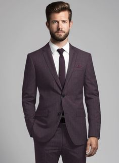 In the realm of fashion our Purple Herringbone Wool Suit transcends mere garments evolving into a canvas for self-expression. Meticulously crafted from a luxurious wool blend, this exquisite textile showcases an elegant herringbone pattern subtly elevated by a refined, regal purple hue. The outcome is a seamless fusion of timeless sophistication and modern flair, positioning this suit as the epitome of refined style suitable for any occasion be it a business meeting or a social gathering.   Look Luxury Herringbone Pattern Suits For Formal Occasions, Luxury Unstitched Purple Suit, Luxury Purple Unstitched Suit, Luxury Purple Suits For Workwear, Luxury Herringbone Long Sleeve Suits, Luxury Elegant Suits With Herringbone Pattern, Luxury Wool Herringbone Suit, Luxury Fitted Herringbone Pattern Suits, Luxury Fitted Herringbone Suits