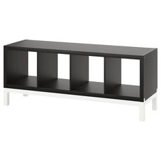 a black and white shelf with four shelves