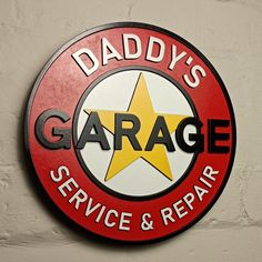 a red and white sign that says daddy's garage service & repair