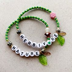 Beautiful nature inspired bracelets Add your own name or words. Here's some ideas... I 💚 plants Plant 💚 life 💚vegan💚 Or you could just have your name. Handmade using quality glass seed beads, glass flower and mushroom, acrylic letter beads, with a gold plated leaf and acrylic green leaf charm on a strong clear elasticated cord. Choose from either a pink flower or a mushroom. Available in 4 sizes. Choose a suitable size at checkout. Personalized Green Bohemian Bracelets, Bohemian Personalized Green Bracelets, Plant Bracelet, Lover Bracelet, Inspired Bracelets, Letter Bead Bracelets, Leaf Beads, Lovers Bracelet, Bracelets With Meaning