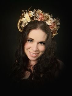 A magical forest fairy flower crown!  This gold mini ram horns headpiece is ideal for a woodland wedding, fairy cosplay, photo shoots and special events.  This sweet smaller sized flower crown, is a spectacular array of earthy browns, gold and cream. This floral headdress has small gold ram horns (about 8cms in size), smaller flowers, artificial pine and acorns and peony flowers. This enchanting headpiece fits children (over 5 yrs) and adults alike. It is also mounted to a wide, firm headband fo Whimsical Crown-shaped Headpiece With Matching Headband, Whimsical Crown Headpiece With Matching Headband, Whimsical Adjustable Crown For Festivals, Whimsical Gold Crown Headpiece, Adjustable Horned Fantasy Headpiece, Whimsical Headpieces With Matching Headband For Costume Party, Whimsical Gold Headpiece For Festival, Whimsical Gold Festival Headpiece, Whimsical Gold Headpieces For Festivals