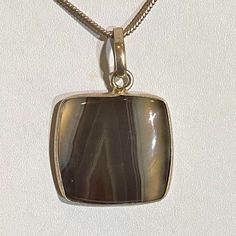 * Handmade Natural Brownish Honey Agate Gem Stone Pendant Necklace. * Brown Agate Improves Inner-Strength, Determination, And Willpower. * Personalized Invaluable Affordable Lasting Gift To Anyone. * Brownish Honey Color. * For Both Men And Women. Agate Necklace With Polished Finish For Gift, Agate Necklace With Polished Finish As A Gift, Large Agate Stone Gemstone For Gift, Large Agate Gemstone As A Gift, Gem Stone Pendant, Brown Agate, Honey Color, Gemstone Pendant Necklace, Honey Colour