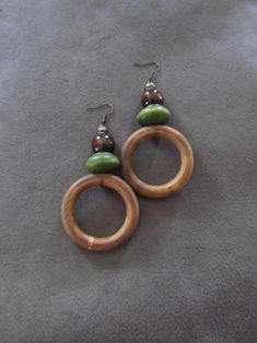 Large brown and green wooden, and bronze beaded earrings on french hooks Artisan Brown Earrings With Wooden Beads, Unique Brown Wooden Beads Earrings, Brown Wooden Bead Earrings, Unique Brown Earrings With Wooden Beads, Mid Century Modern Earrings, Afrocentric Earrings, African Earrings, Ethnic Earrings, Wooden Earrings