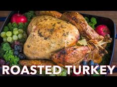 roasted turkey with grapes and broccoli in a roasting pan