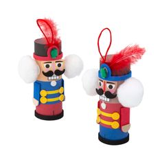 two wooden nutcrackers with red feathers on their heads, one is blue and the other is yellow