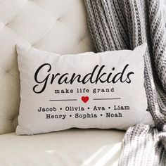 a pillow that says grandkids make life great on the back of a couch