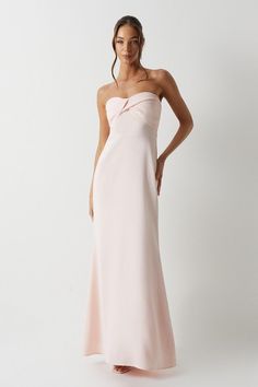 a woman in a strapless pink gown