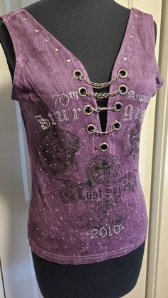 70th annual Sturgis motorcycle rally original tank top with open back, skulls, chains, and rhinestones. Size medium. Such a cool, unique tank top! Y2k Festival Sleeveless Tank Top, Y2k Sleeveless Festival Tank Top, Y2k Sleeveless Festival Tops, Y2k Sleeveless Tank Top For Festivals, Gothic Sleeveless Tops For Festivals, Y2k Sleeveless Tops For Festival, Fitted Sleeveless Biker Top, Punk Style Tank Top For Festivals, Gothic Sleeveless Top With Skull Print