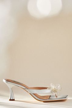 Complete with a beaded flower embellishment and flared kitten heel, these floral heels by Vanina will elevate any look. | Floral Heels by Vanina in Silver, Women's, Size: 36, Polyester/Rubber/Satin at Anthropologie Spring Wedding Kitten Heels With Almond Toe, Almond Toe Kitten Heels With Sculpted Heel For Wedding, Spring Wedding Almond Toe Kitten Heels, Feminine Embellished Pointed Toe Heels, Pointed Toe Kitten Heels With Sculpted Heel For Wedding, Spring Wedding Low Heel Kitten Heels, Spring Gala Kitten Heels With Low Heel, Glamorous Spring Kitten Heels With 4-inch Heel, Spring Gala Kitten Heels